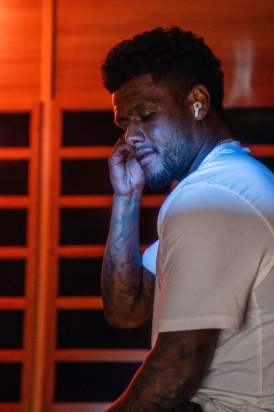 athlete sitting in infrared sauna at Neuro Physique in Centerville, Utah
