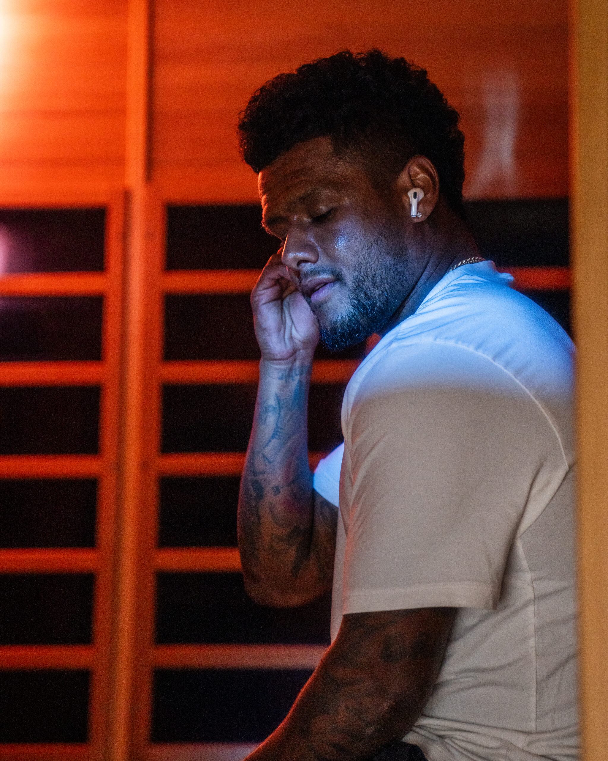 athlete sitting in infrared sauna at Neuro Physique in Centerville, Utah